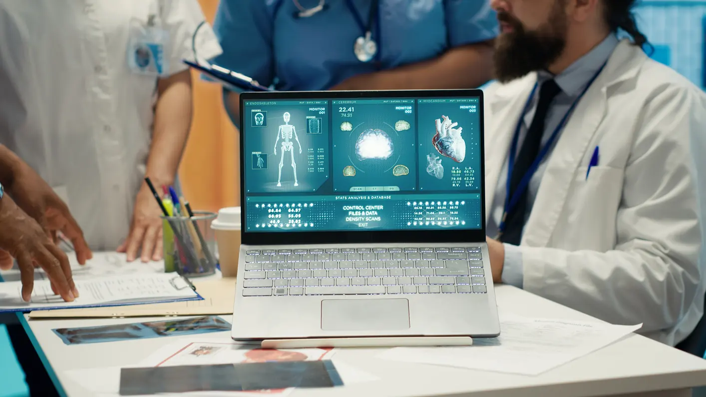 Medical Team Examining on Laptop