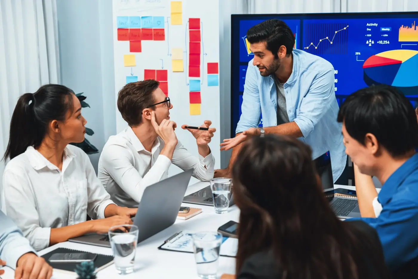Analyst team utilizing BI fintech analyzing data table prudent